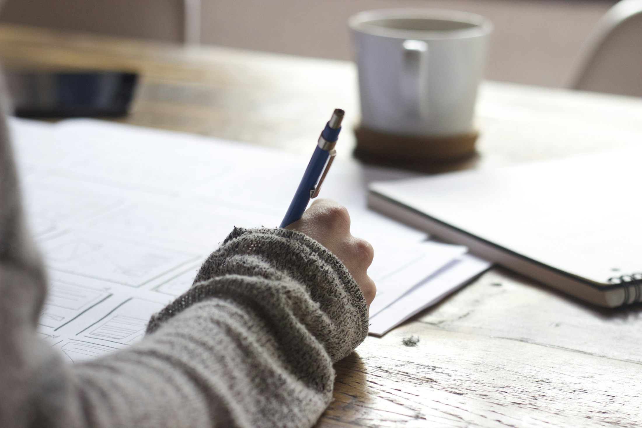 Notebook and pen on a desk, planning and notes
